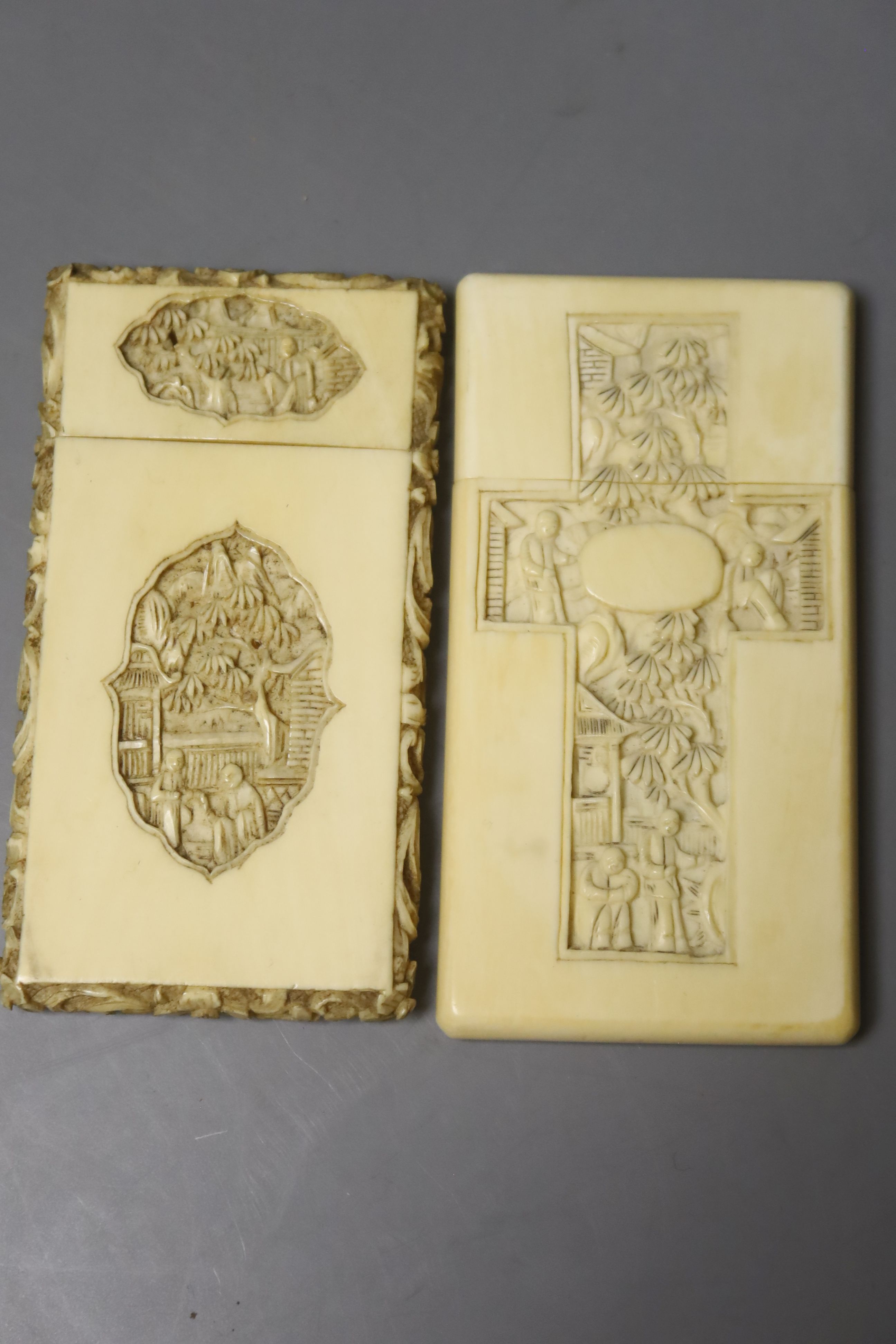 Two Chinese carved ivory card cases, largest 12 x 8cm